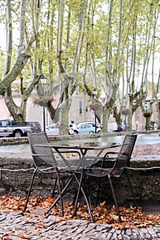 Tables and chairs of street cafe