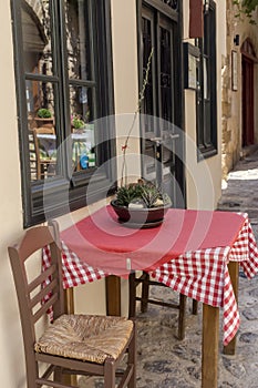 The tables and chairs of a street cafe-restaurant photo