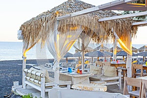 Tables near the Perissa beach in cafe, Santorini island