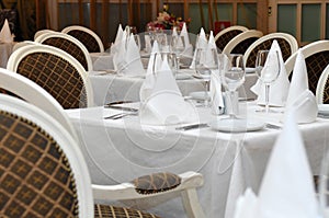 Tables in the restaurant prepared to receive guests