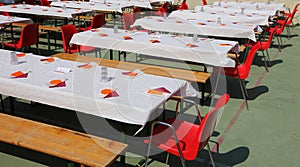 Tables set for a community lunch with many guests