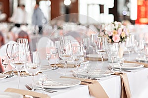 Tables set for an event party or wedding reception. luxury elegant table setting dinner in a restaurant. glasses and