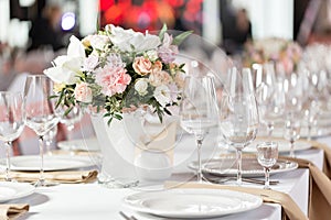 Tables set for an event party or wedding reception. luxury elegant table setting dinner in a restaurant. glasses and