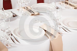 Tables set for an event party or wedding reception. luxury elegant table setting dinner in a restaurant. glasses and