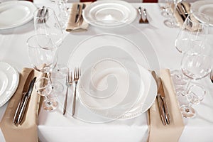 Tables set for an event party or wedding reception. luxury elegant table setting dinner in a restaurant. glasses and