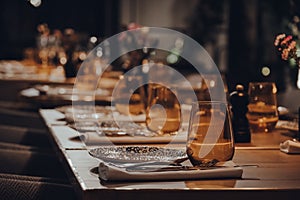 Tables set inside a restaurant, shallow focus