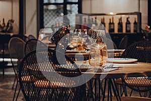 Tables set inside a restaurant, shallow focus