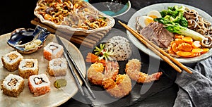 Tables spread with traditional Japanese cuisine