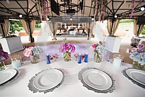 Tables for the wedding reception. A luxurious elegant table setting dinner in a restaurant.