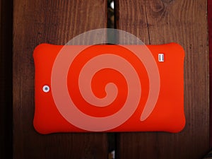 Tablet on the Android platform for children. Tablet with a bright cover and a large screen.