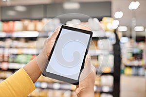 Tablet with blank white screen mockup in supermarket