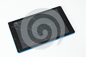 Tablet with broken screen on white background