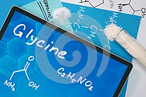 Tablet with the chemical formula of Glycine.