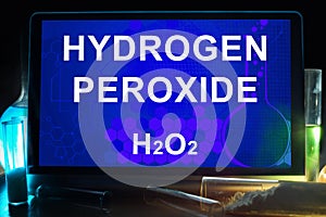 Tablet with chemical formula of hydrogen peroxide. photo