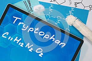Tablet with the chemical formula of Tryptophan .