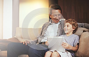 Tablet, child or happy grandfather talking or smiling in conversation in retirement at home to relax. Grandparent or kid