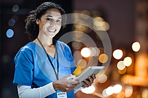 Tablet, city and portrait of a doctor working at night on the rooftop of the hospital building in city. Medical, lights