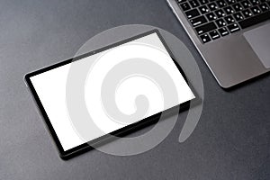Tablet computer empty white mockup screen template on the office table