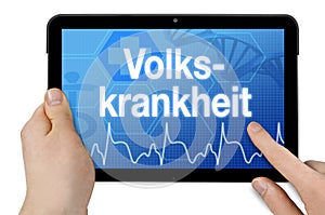 Tablet computer with the german word for widespread disease - volkskrankheit