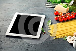 Tablet with copy space with Ingredients for cooking Italian past