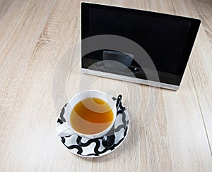 Tablet and a cup of tea