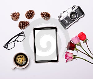 Tablet with empty screen camera and other retro objcects around it on white background - Trendy minimal flat lay concept