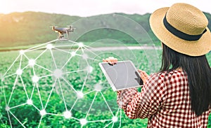 Tablet in the hands of farmers technology drones to control agricultural