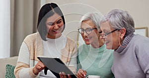 Tablet, laughing and a carer with senior women in a retirement home or assisted living community. Technology, healthcare