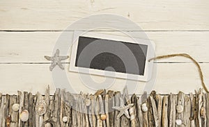 Tablet with maritime decorated white wood background