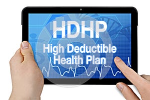 Tablet with medical device showing the acronym HDHP high deductible health plan isolated
