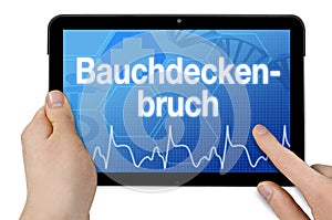 Tablet with medical touchscreen and the german word for abdominal wall hernia - bauchdeckenbruch