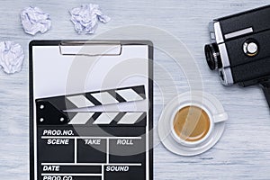 A tablet for a movie script and a cup of coffee on the director`s table