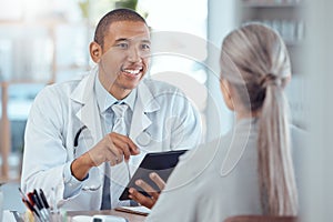 Tablet, office and doctor consulting a patient in a health conversation or communication during medical consultation