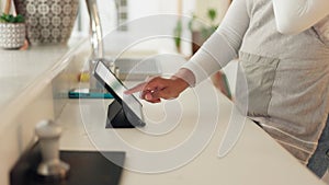 Tablet, order and a waitress working in a coffee shop on a wireless interface for service or payment. Cafe, kitchen and