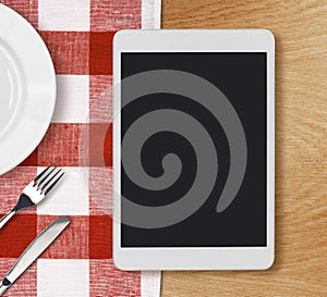 Tablet pc on dinner table