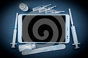 Tablet pc with medical objects on a desk