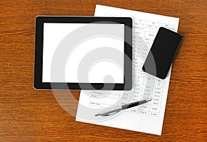 Tablet pc, smart phone and paper with graphs