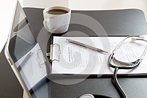 Tablet Pc and Stethoscope on desk