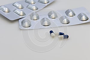 Tablet of pharmaceutical capsules on the table
