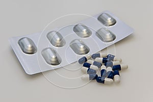 Tablet of pharmaceutical capsules on the table