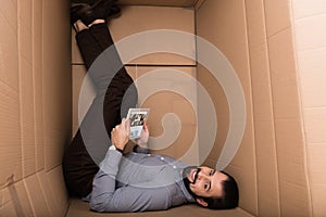 smiling man using digital tablet with depositphotos website