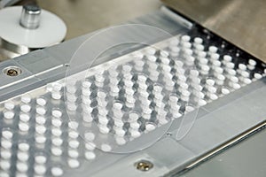 Tablet pill production. Blistering conveyer photo