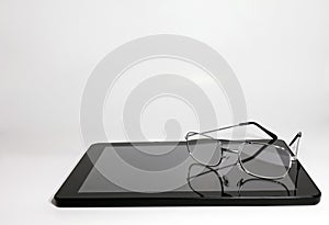 Tablet and Reading Glasses