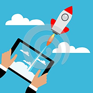 Tablet with a rocket.Concept of Start up.