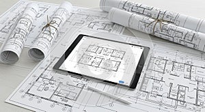 Architectural Design with Tablet and Blueprints