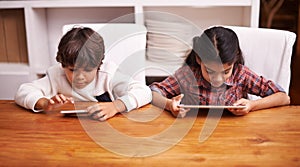 Tablet, search and kid siblings with phone in a kitchen for google it, gaming or bonding at home. Family, subscription