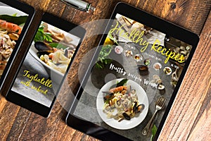 Tablet and smartphone healthy recipes blog on screen. Web on th