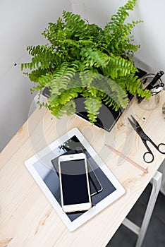 Tablet and smartphone on office table