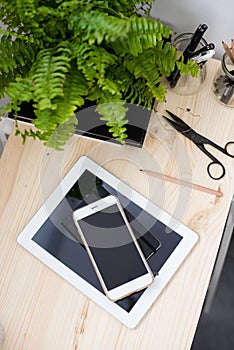 Tablet and smartphone on office table