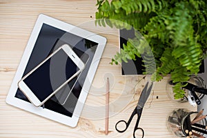 Tablet and smartphone on office table